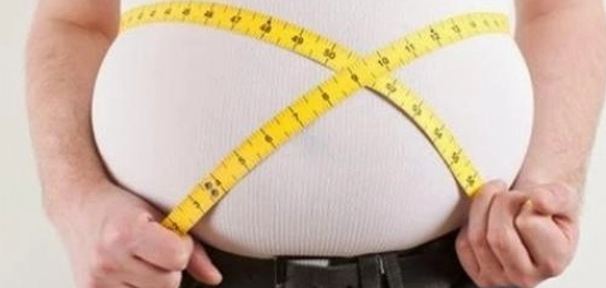 فهم السمنة: الأسباب والعلاج